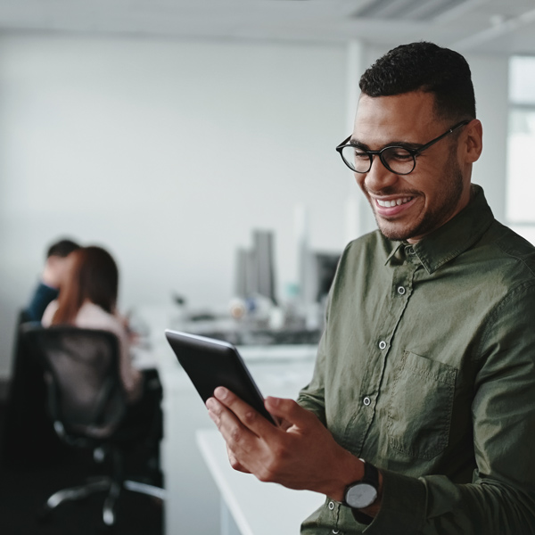 man using tablet in office