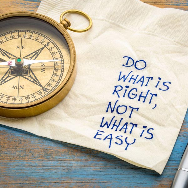 compass and napkin penned with inspirational message